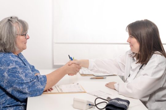 doctor and patient shaking hands