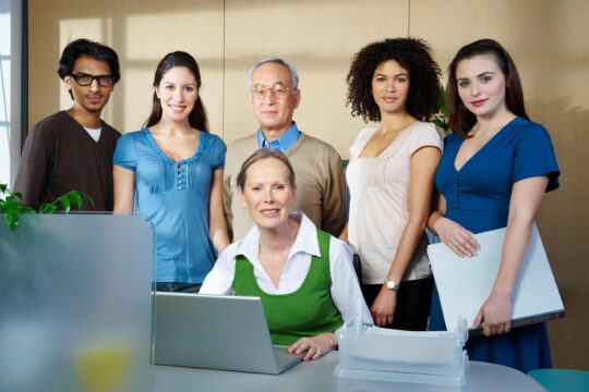 Portrait of group of people in office